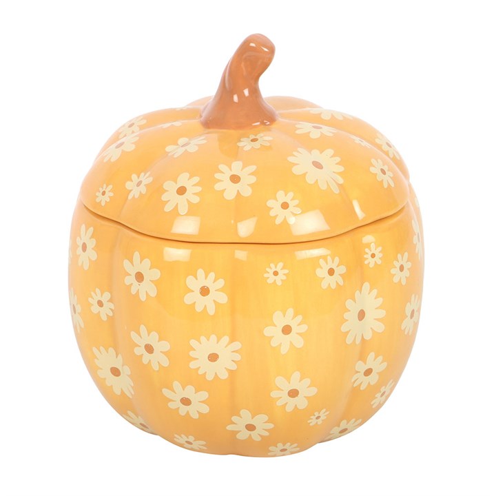 Yellow pumpkin-shaped cookie jar with white floral patterns on a white background