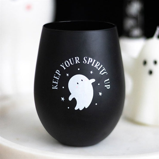 Black stemless wine glass with ghost design and text on a white surface.