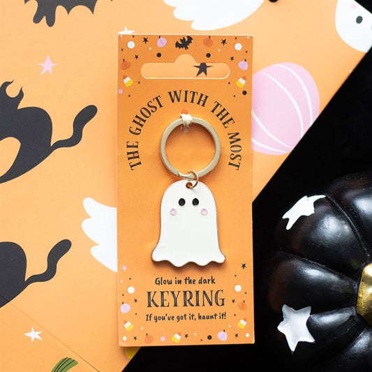 Glow-in-the-dark ghost keyring on an orange card with Halloween-themed design