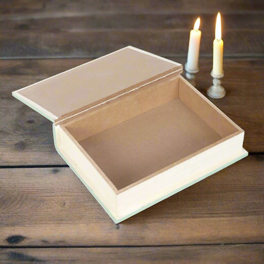 sage green faux book storage box, 'Myths, Fairy Tales & Legends' displayed on a wooden table next to candles - Fae Cottage