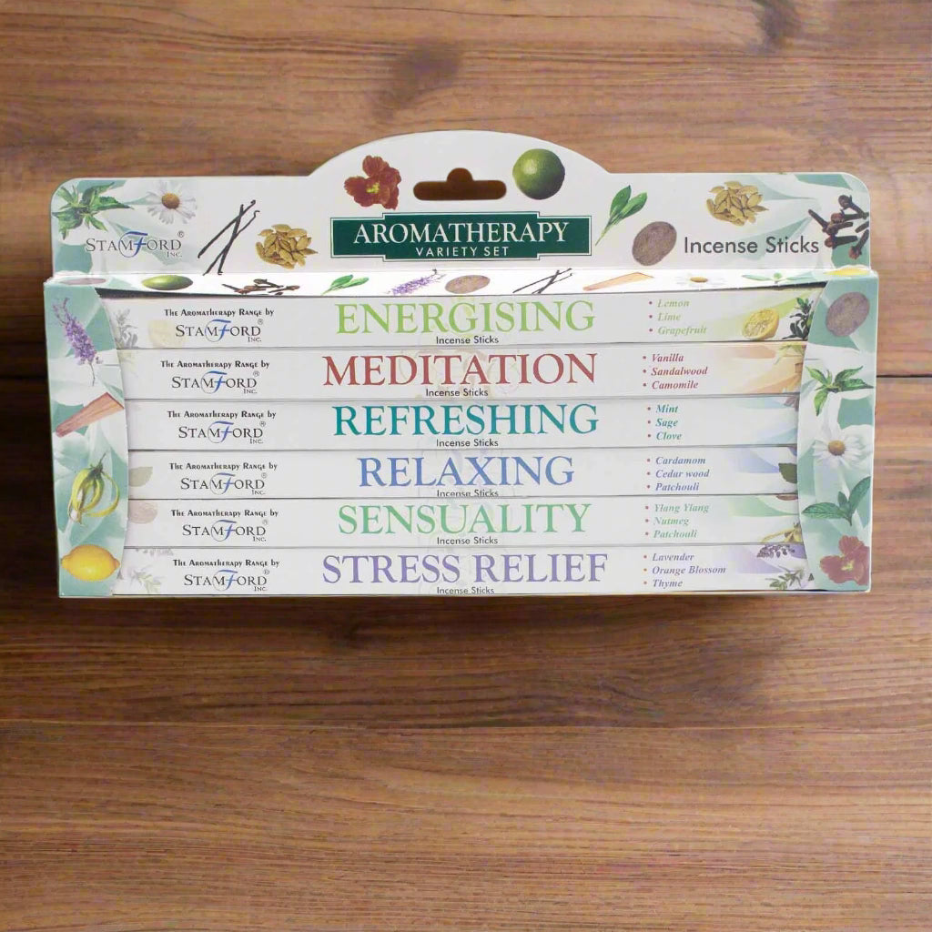 Aromatherapy incense sticks variety set packaging with different scents on a wooden table.