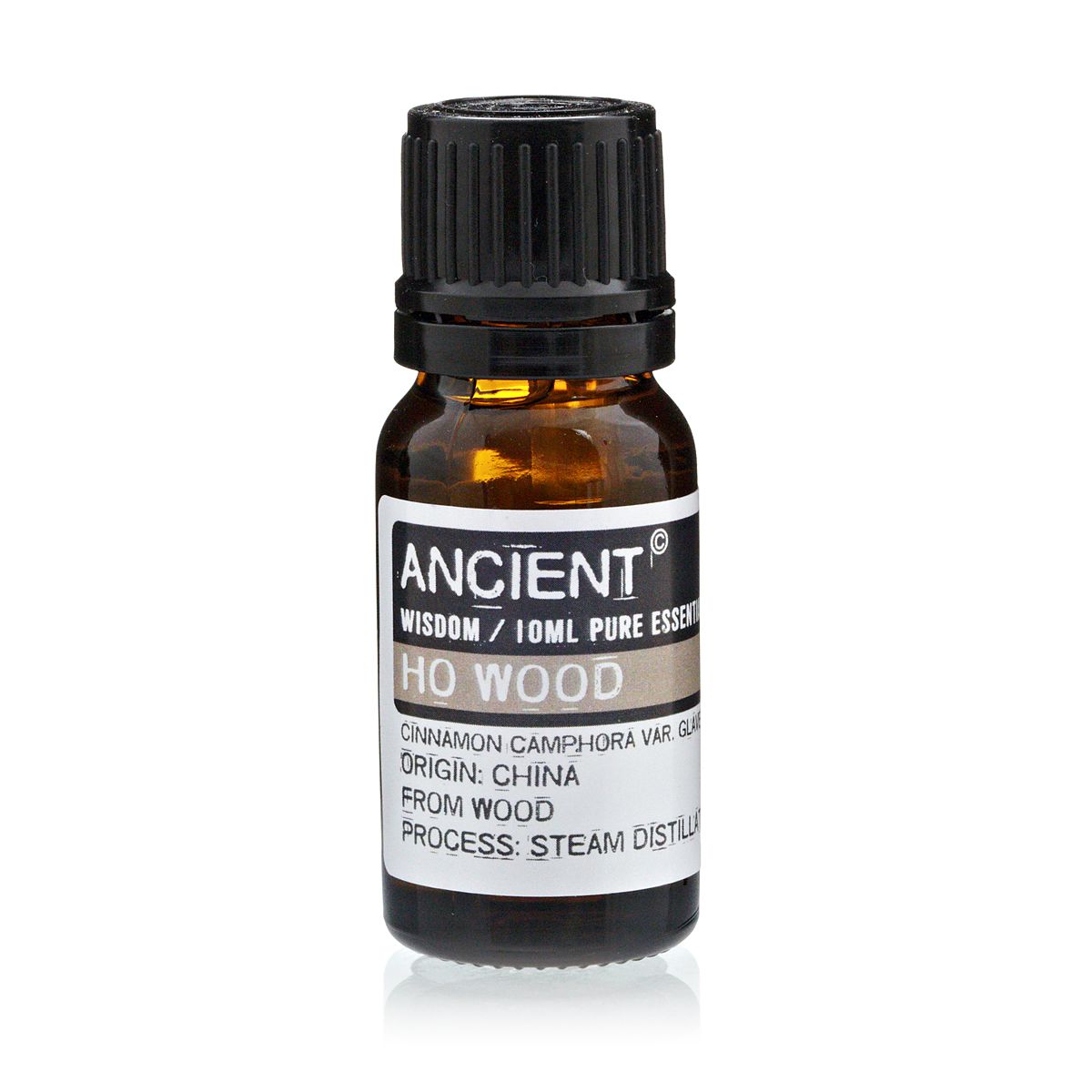 Amber 10 ml bottle labelled ‘Ho Wood—pure essential oil’, steam-distilled from Chinese camphor wood, with a soft, sweet-woody aroma known for relaxation and skin renewal
