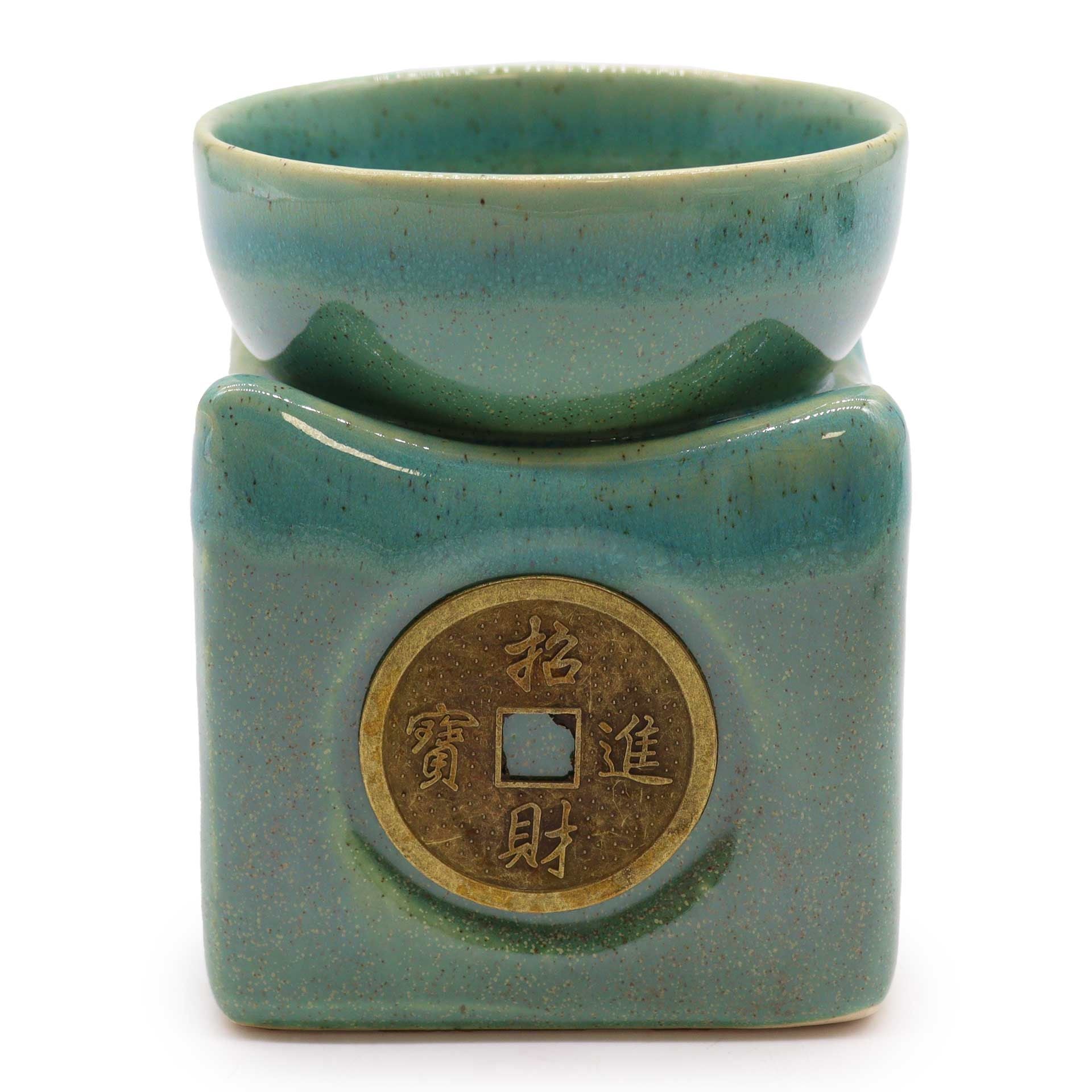 front view highlighting the brass-toned lucky coin and smooth jade glaze.