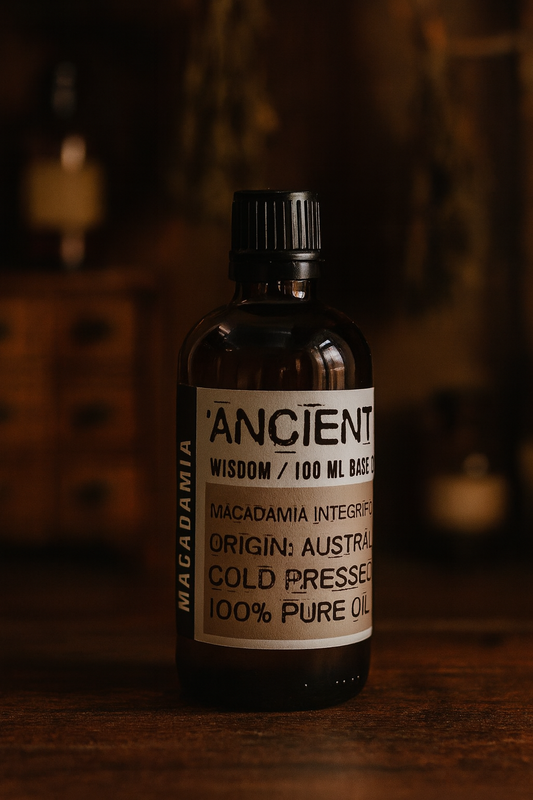 Amber glass bottle with black cap labelled ‘Macadamia—cold-pressed’; a clear golden, mildly nutty Macadamia integrifolia seed oil from Australia with a cushioned, satin glide