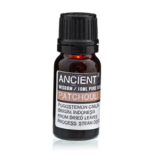 Amber 10 ml bottle labelled ‘Patchouli—pure essential oil’, steam-distilled from dried leaves. A musky, earthy, grounding oil with skin-regenerative and balancing benefits.