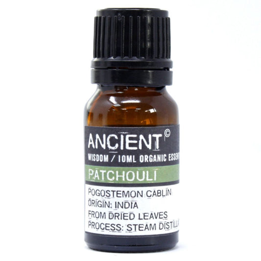 Amber glass bottle labelled ‘Patchouli—organic, steam-distilled leaf oil,’ an earthy, musky base note for grounding aromatherapy and well-diluted skincare.