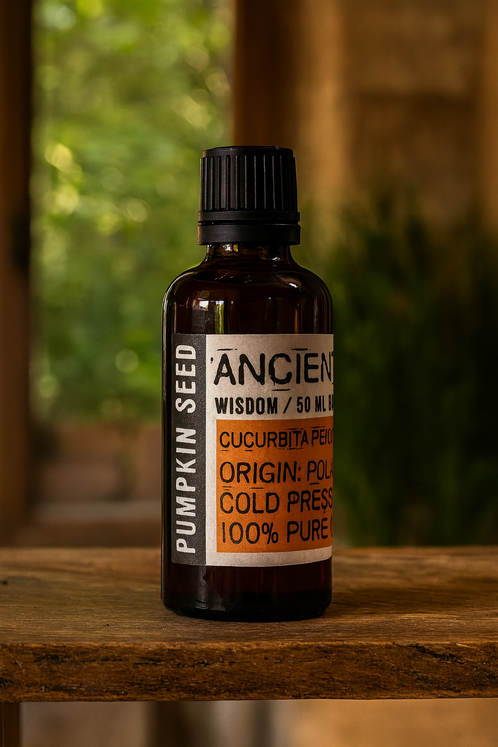 Amber glass bottle with black cap labelled ‘Pumpkin Seed—cold-pressed’; a dark green-to-red Cucurbita pepo seed oil from Poland with a nutty, earthy scent and medium-to-heavy, cushioned glide for face, body and scalp blends.