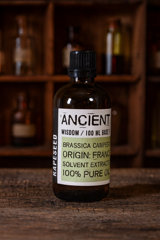 Amber glass bottle with black cap labelled ‘Rapeseed—refined’; a pale golden, virtually odourless Brassica campestris seed oil from France with a light, fast-absorbing finish.