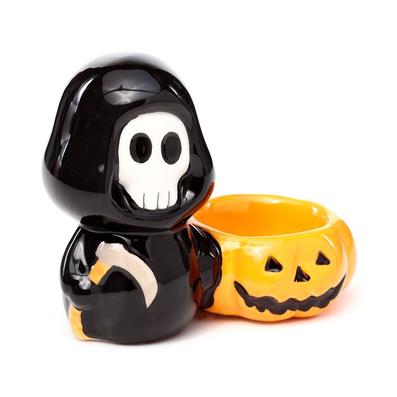 Glossy black Skull Boy with jack-o’-lantern bowl, front three-quarter view.