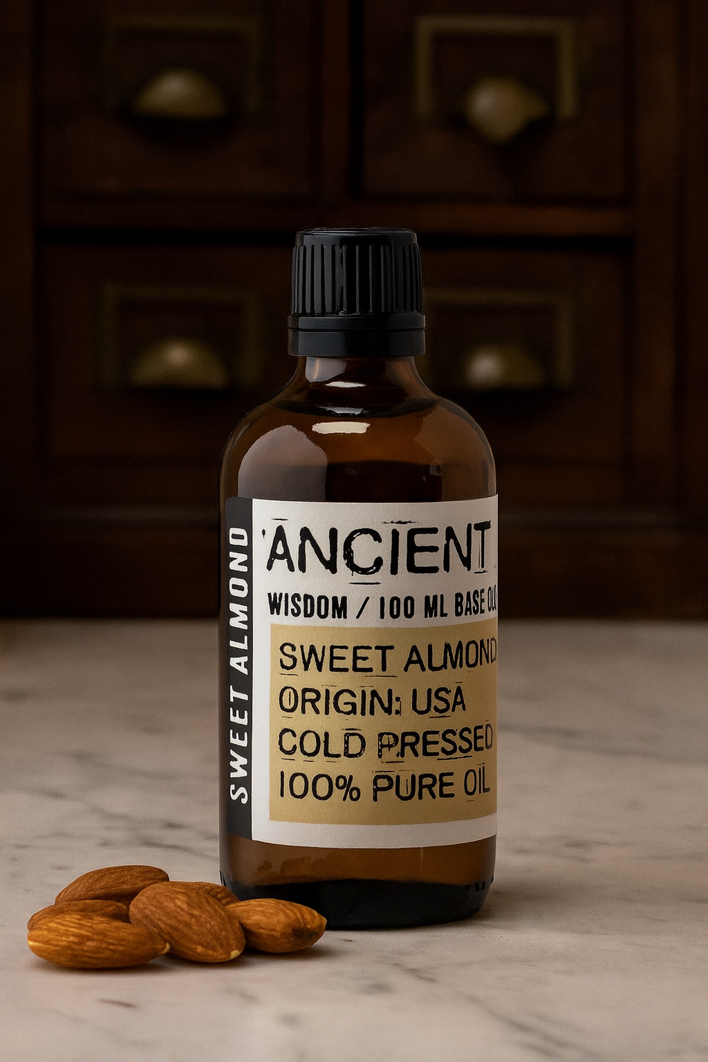 Amber glass bottle with black cap labelled ‘Sweet Almond—cold-pressed’; a pale yellow, nearly odourless Prunus amygdalus dulcis oil from the USA with a very light, silky glide for face, body and massage blends.