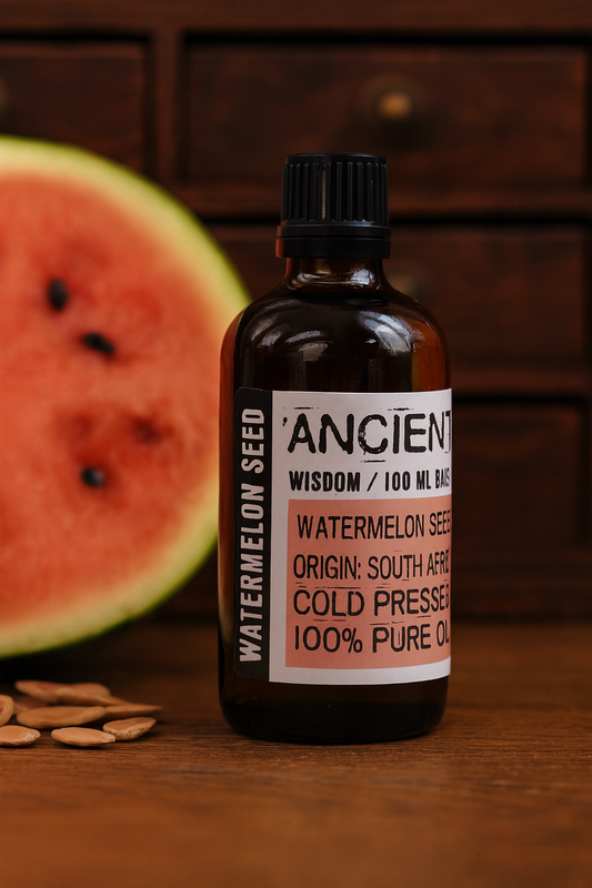 Amber glass bottle with black cap labelled ‘Watermelon Seed—cold-pressed’; a pale yellow-gold Citrullus lanatus seed oil with a light, fast-absorbing feel for face, body and hair blends.