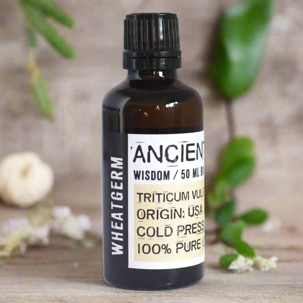 Wheatgerm carrier oil in an amber glass bottle with black cap; cold-pressed, vitamin E–rich—ideal antioxidant booster for DIY skincare.