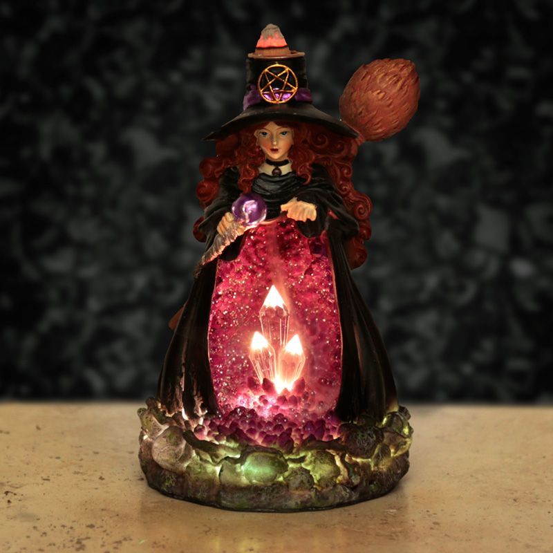 Crystal Witch backflow incense burner lit, LED glowing geode and cascading smoke.