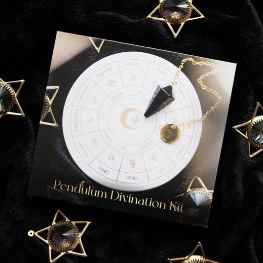 Pendulum Divination Kit with astrological chart and pendulum on a black background