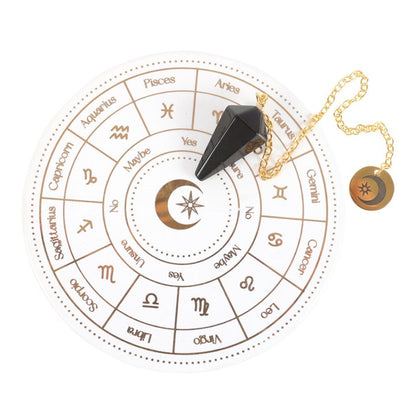 Black crystal pendulum on a white background with astrological symbols