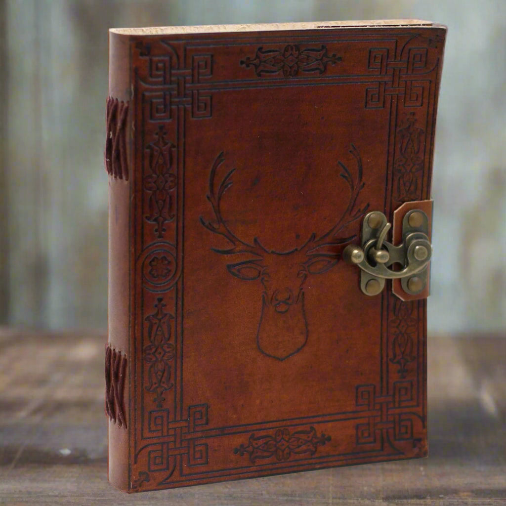 Antiqued leather journal with buckle/clasp, burnt edges and 200 eco-friendly pages. Notebook, diary or sketchbook—shop Fae Cottage.