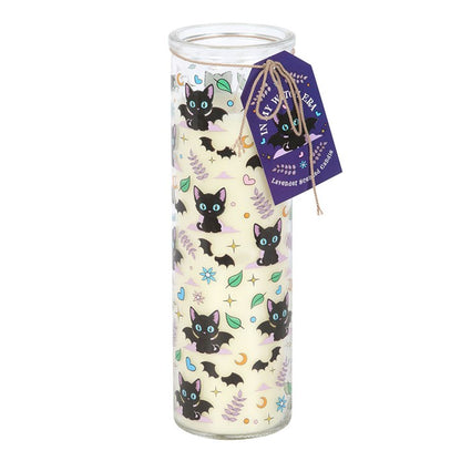 Glass candle with black cat design and purple tag on a white background