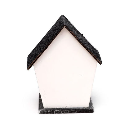Small white haunted house with glittery black roof, spider web windows and warm LED glow - plain rear view