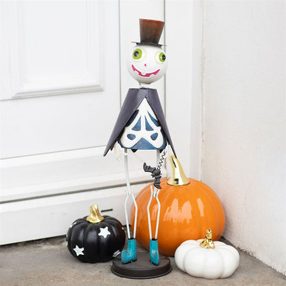 Halloween-themed decorative figure with pumpkins on a neutral background