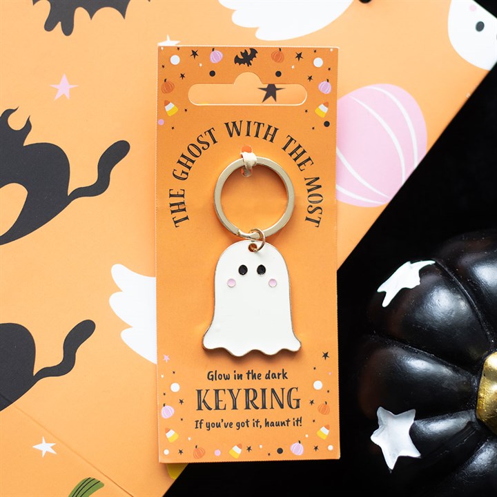 Glow-in-the-dark ghost keyring on an orange card with Halloween-themed design