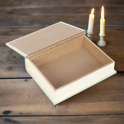 sage green faux book storage box, 'Myths, Fairy Tales & Legends' displayed on a wooden table next to candles - Fae Cottage