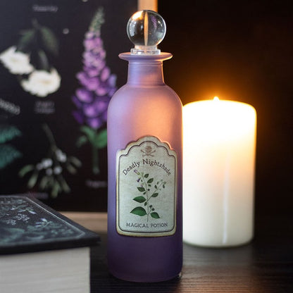 Purple potion bottle labeled 'Deadly Nightshade Magical Potion' with a candle in the background