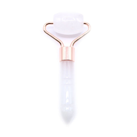 White facial roller with rose gold accents on a white background