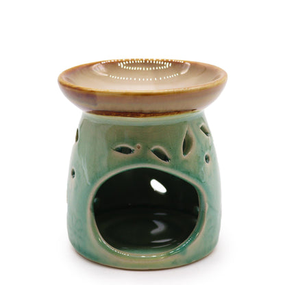 Front view of the classic blue ceramic oil burner with wide dish and leaf cut-outs.