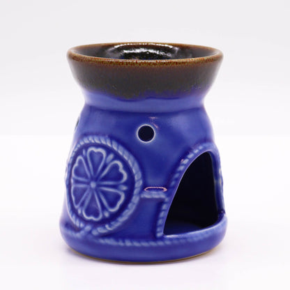 Classic blue ceramic oil burner with brown rim, front angled view.