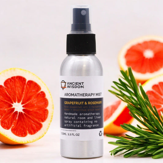 Brushed-aluminium spray bottle with black atomiser labelled ‘Aromatherapy Mist—Grapefruit & Rosemary’; a natural room and linen spray made with Yorkshire water, distilled witch hazel, grapefruit peel and rosemary leaf essential oils.