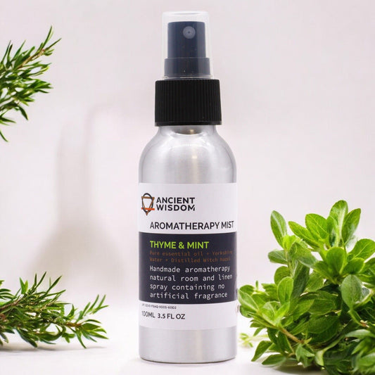 Brushed-aluminium spray bottle with black atomiser labelled ‘Aromatherapy Mist—Thyme & Mint’; a natural room and linen spray made with Yorkshire water, distilled witch hazel, thyme and spearmint essential oils.