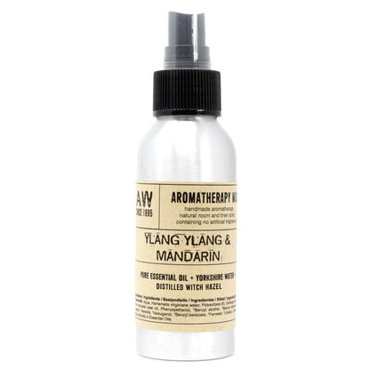 Brushed-aluminium spray bottle with black atomiser labelled ‘Aromatherapy Mist—Ylang Ylang & Mandarin’; a natural room and linen spray made with Yorkshire water, distilled witch hazel, ylang ylang flower and mandarin peel essential oils.