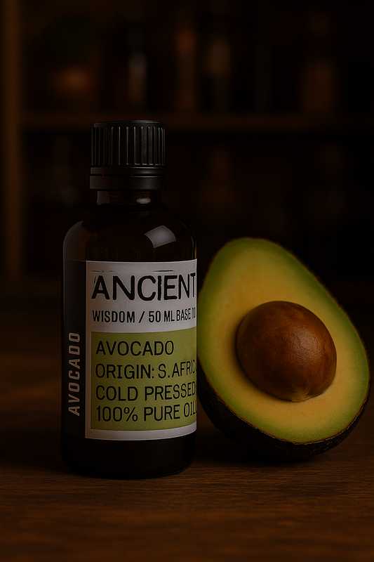 Amber glass bottle with black cap labelled ‘Avocado—cold-pressed’; a dark-to-light green Persea gratissima oil from South Africa with a mild fruity-nutty aroma and creamy, slow-absorbing glide.