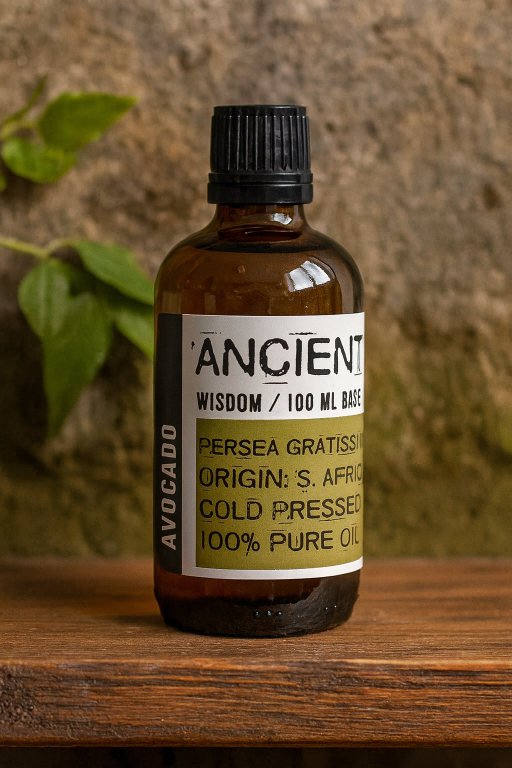 Amber glass bottle with black cap labelled ‘Avocado—cold-pressed’; pale yellow to light-green Persea gratissima oil from South Africa with a smooth, silky texture.