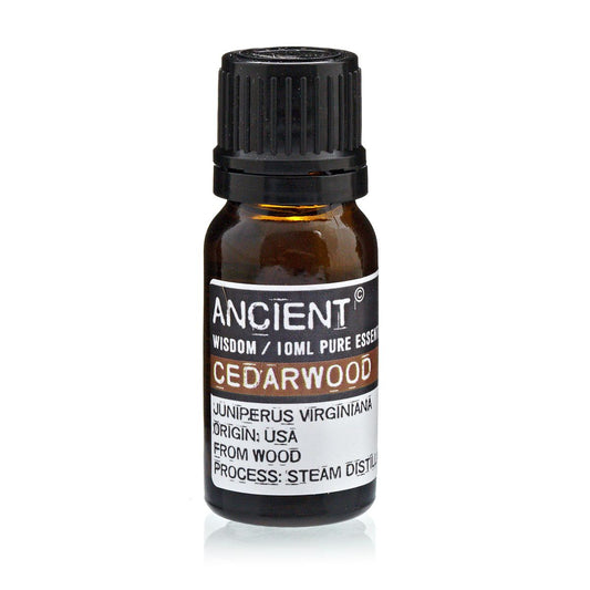 Amber 10 ml bottle labelled ‘Cedarwood—pure essential oil’, a steam‑distilled, dry‑woody aroma with a softly smoky, balsamic tone for grounding blends.