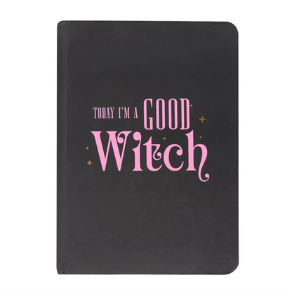 Black A5 notebook with pink “Good Witch” and green “Bad Witch” reversible covers and gold-edged pages.