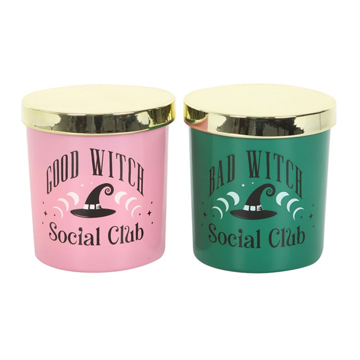 Two scented glass candles, one pink “Good Witch” and one green “Bad Witch,” lit and displayed with gold lids; giftable set.
