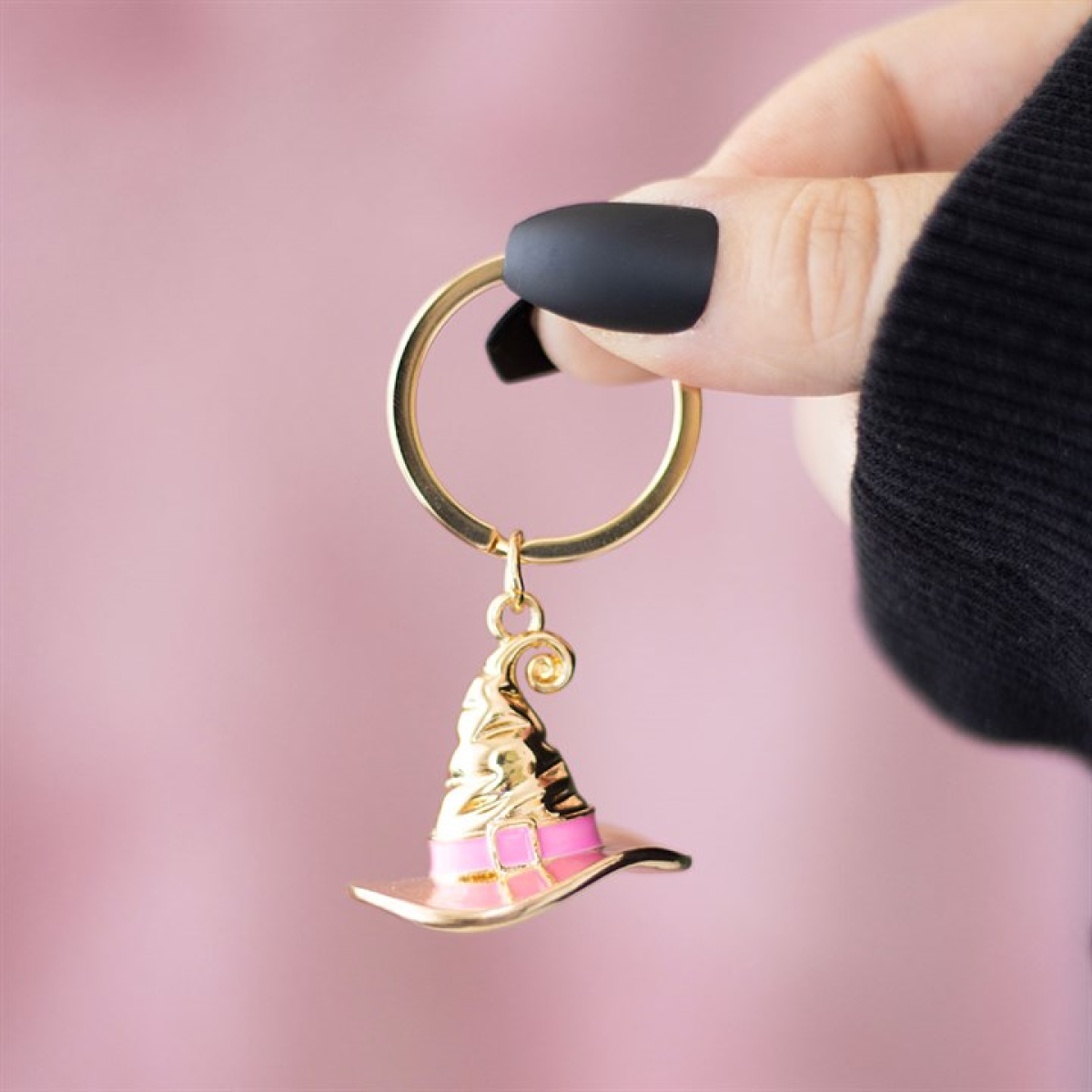 Gold-tone witch hat keyring with a pink enamel band, engraved “Good Witch,” shown on a keyring—cute witchy keychain accessory.