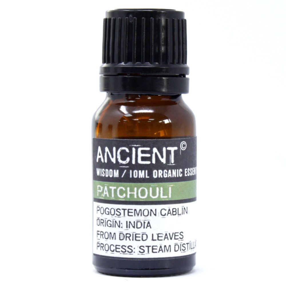 Amber glass bottle labelled ‘Patchouli—organic, steam-distilled leaf oil,’ an earthy, musky base note for grounding aromatherapy and well-diluted skincare.