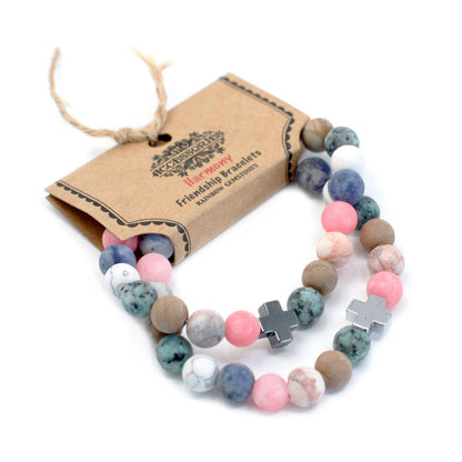Pair of rainbow gemstone bracelets presented on a kraft gift card with twine.