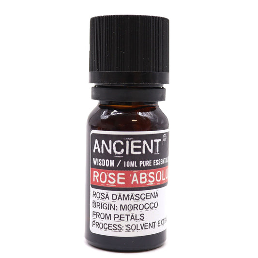 Amber 10 ml bottle labelled Rose Absolute pure essential oil, solvent-extracted in Morocco from rose petals, used for skincare, mood balance, and emotional healing.