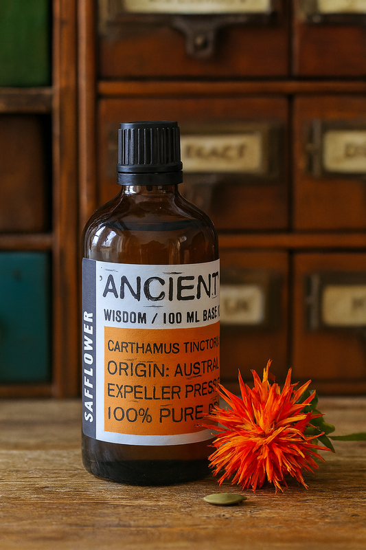Amber glass bottle with black cap labelled ‘Safflower—cold-pressed’; a pale yellow Carthamus tinctorius seed oil from Australia with a feather-light, fast-absorbing feel for face, body and hair blends.