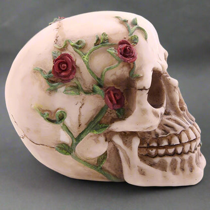 Decorative skull with floral design on a grey background