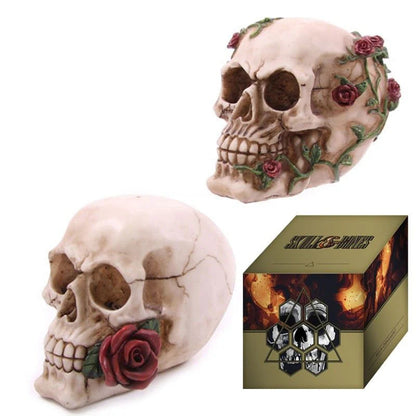 Decorative skull with floral arrangements and a product box featuring skulls and roses.