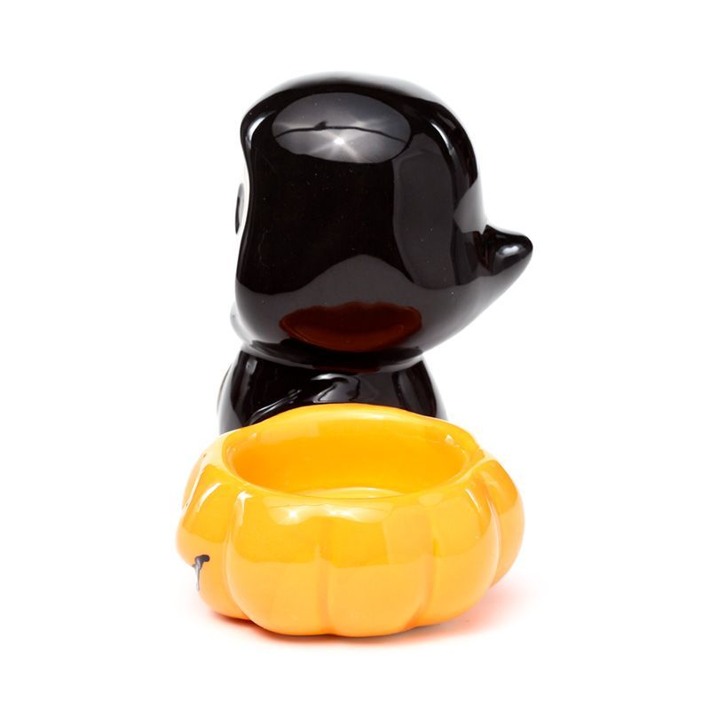 side view highlighting the skull boy pumpkin tealight bowl.