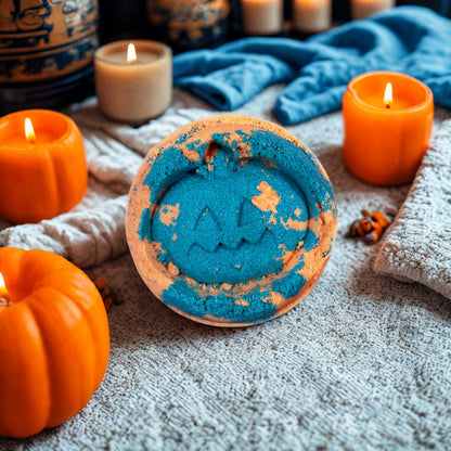 Blue and orange jack-o’-lantern shaped bath bomb, handmade in the UK, scented with fennel and sweet orange.