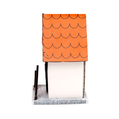 right side view highlighting orange roof pattern and white walls on a grey base.  Side profile showing roof detail.