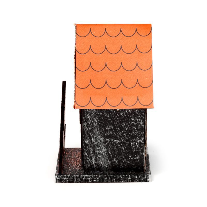 Side profile of small MDF pumpkin house with printed orange shingle roof on a square base, unlit.