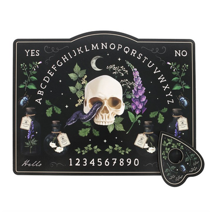 Black talking board featuring skull, foxglove and potion bottles with a matching planchette; botanical aesthetic.